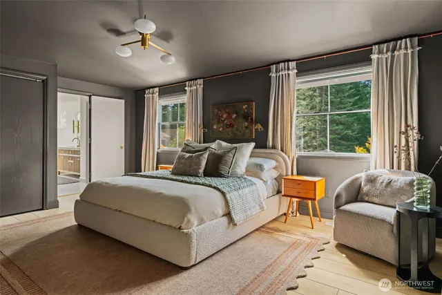 a view of a white house with a yard and plants