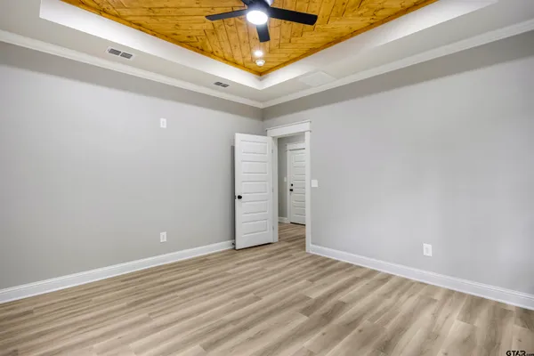 a spacious bathroom with a shower sink and mirror