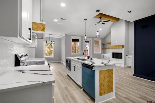 a kitchen with a stove and a sink