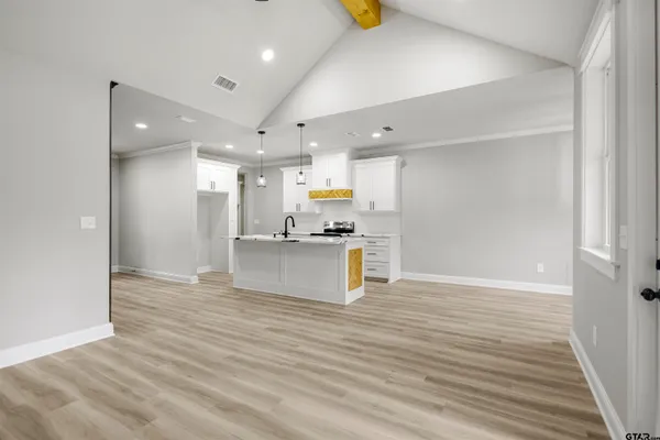 a view of kitchen and kitchen with wooden floor