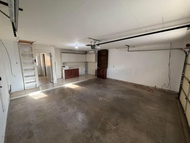 a view of a empty room with a fireplace