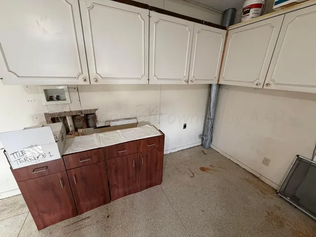 a bathroom with a glass door shower and a sink