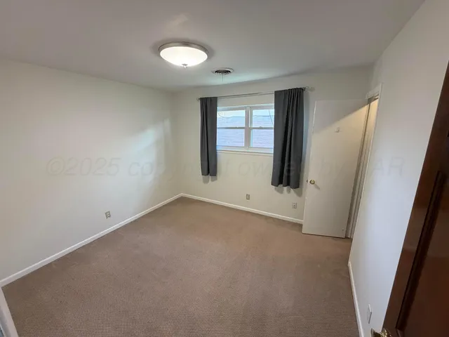 an empty room with closet