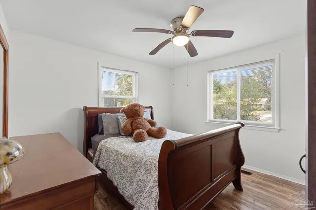 a bed room with a bed and a window