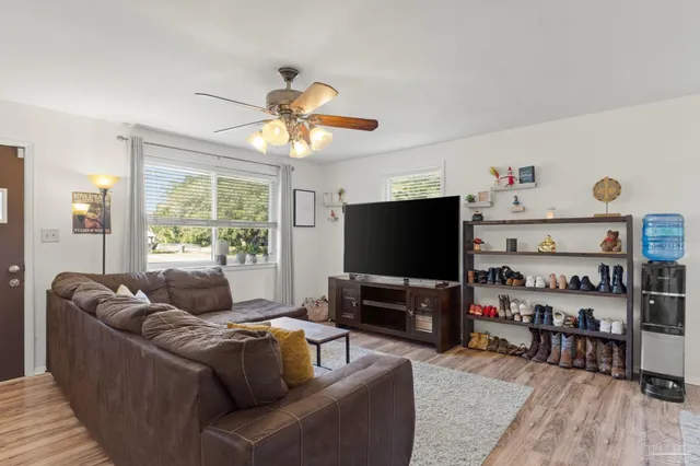 a living room with furniture and a flat screen tv