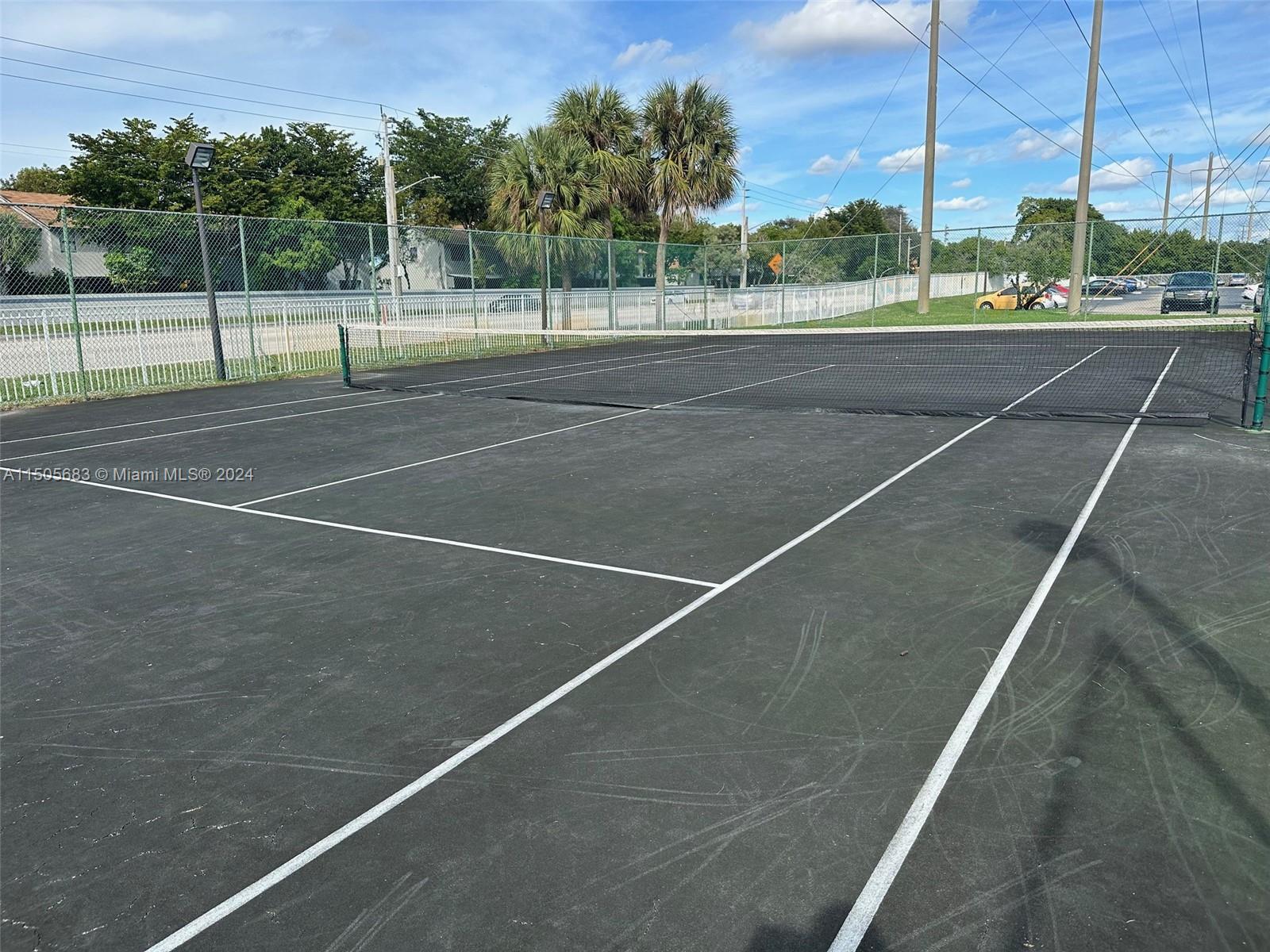 5686 Rock Island Road, Unit 134 Tamarac, FL 33319 - Photo 11 of 21 a view of a tennis court