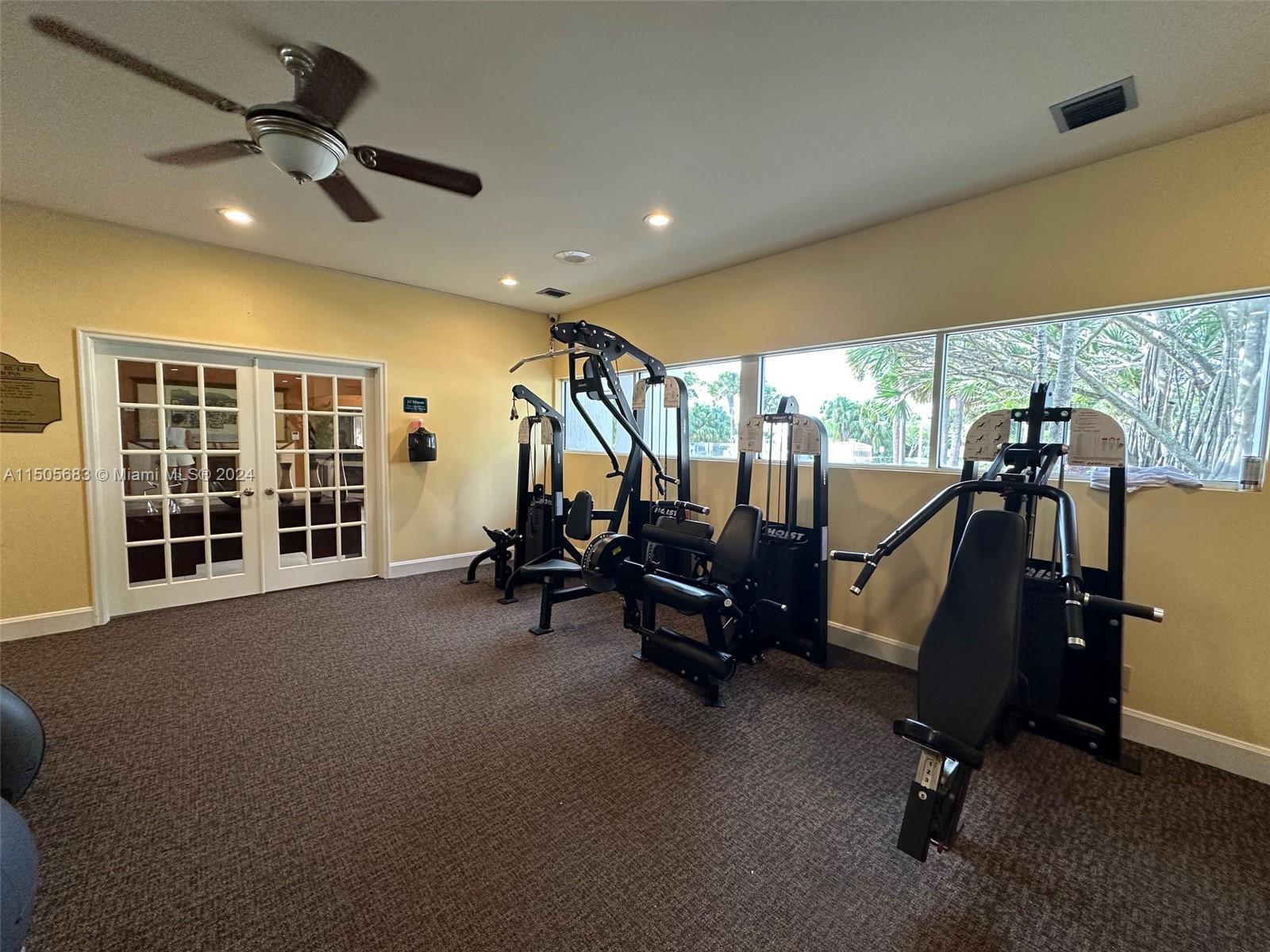 5686 Rock Island Road, Unit 134 Tamarac, FL 33319 - Photo 16 of 21 a view of a room with gym equipment