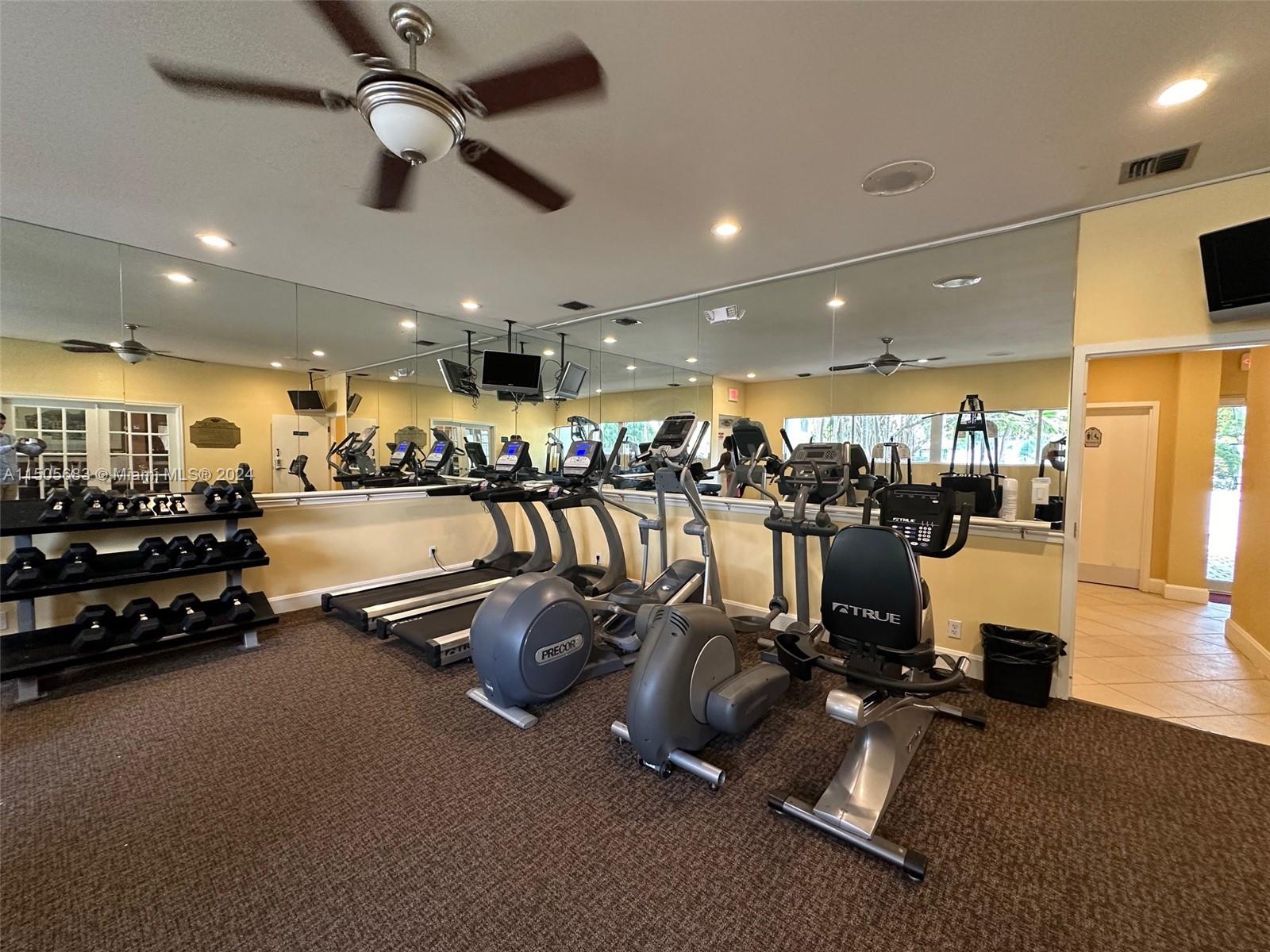 5686 Rock Island Road, Unit 134 Tamarac, FL 33319 - Photo 17 of 21 a view of a room with gym equipment