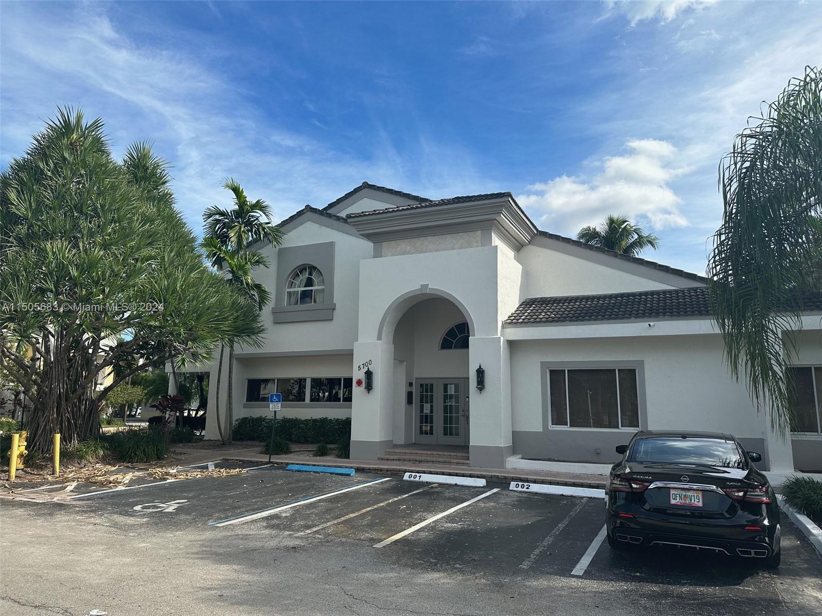 5686 Rock Island Road, Unit 134 Tamarac, FL 33319 - Photo 18 of 21 a view of a car park in front of a house