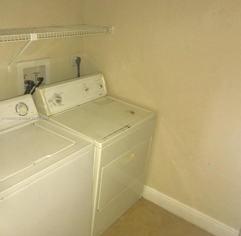 5686 Rock Island Road, Unit 134 Tamarac, FL 33319 - Photo 6 of 21 a utility room with dryer and washer
