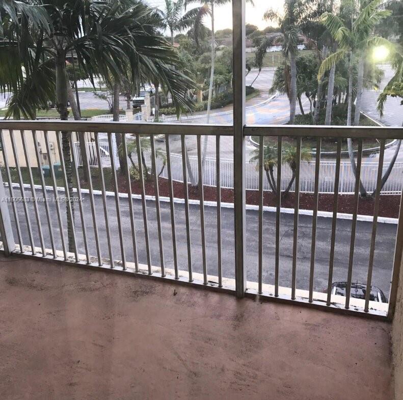 5686 Rock Island Road, Unit 134 Tamarac, FL 33319 - Photo 7 of 21 a view of a porch with wooden floor