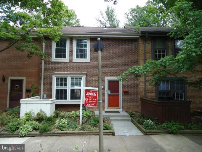 2141 Golf Course Drive Reston, VA 20191 - Photo 1 of 26 a front view of a house with a garage