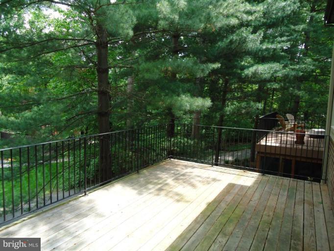 2141 Golf Course Drive Reston, VA 20191 - Photo 12 of 26 a view of balcony with wooden floor and fence