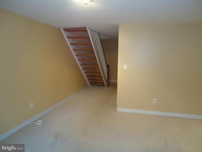2141 Golf Course Drive Reston, VA 20191 - Photo 18 of 26 a view of an empty room with stairs