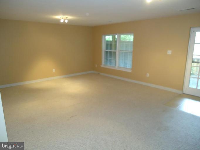 2141 Golf Course Drive Reston, VA 20191 - Photo 19 of 26 an empty room with windows and entrance