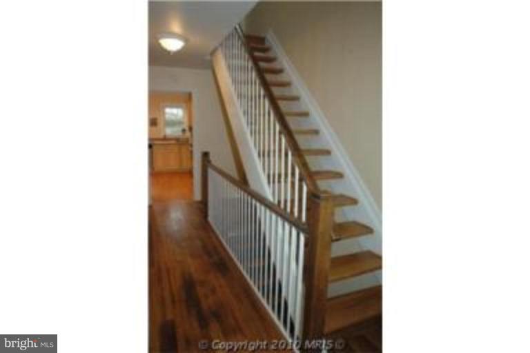 2141 Golf Course Drive Reston, VA 20191 - Photo 4 of 26 a view of a hallway with staircase