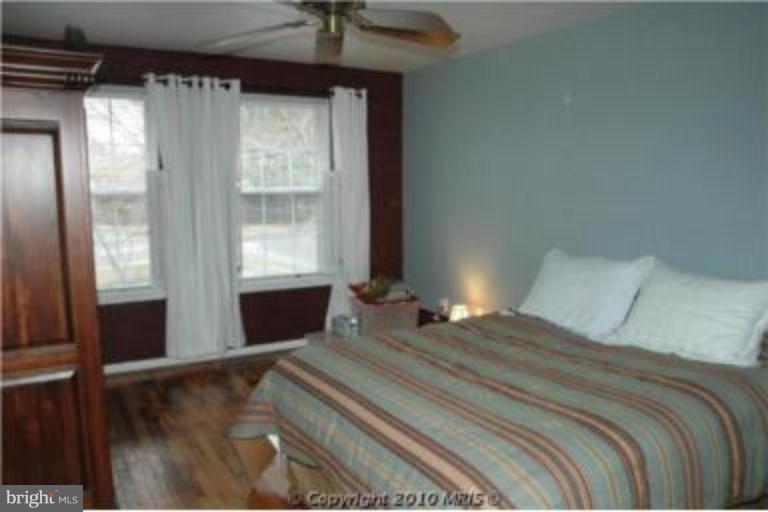 2141 Golf Course Drive Reston, VA 20191 - Photo 5 of 26 a bedroom with a bed and a window