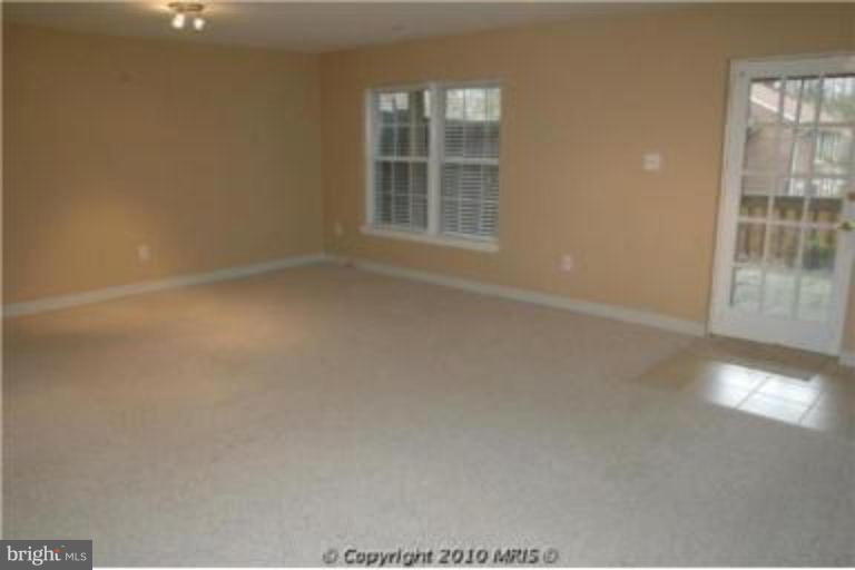 2141 Golf Course Drive Reston, VA 20191 - Photo 6 of 26 an empty room with windows