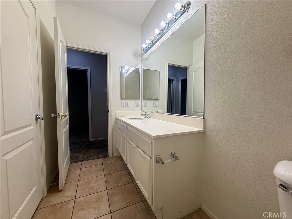 3518 Ranch Street Perris, CA 92571 - Photo 11 of 66 a bathroom with a sink a toilet and mirror