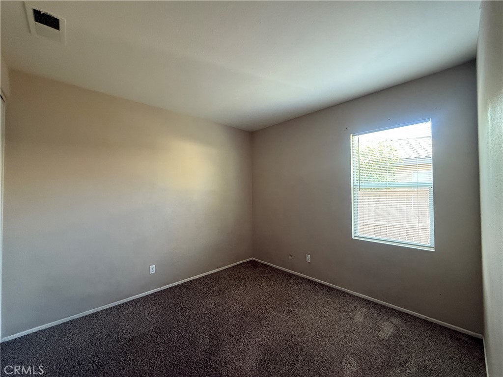 3518 Ranch Street Perris, CA 92571 - Photo 12 of 66 an empty room with a window