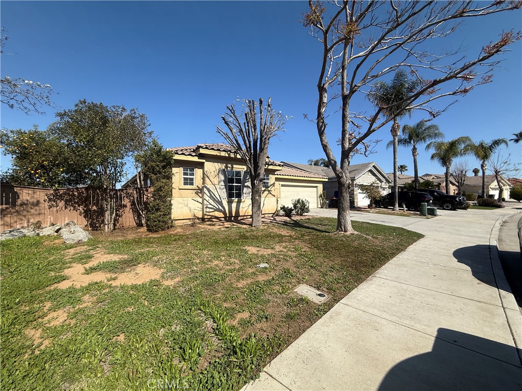 3518 Ranch Street Perris, CA 92571 - Photo 2 of 66 a view of a yard with cars