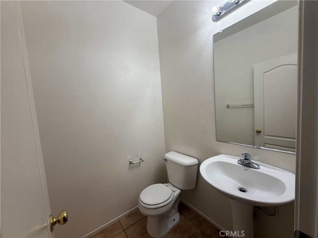3518 Ranch Street Perris, CA 92571 - Photo 26 of 66 a bathroom with a sink toilet and a mirror