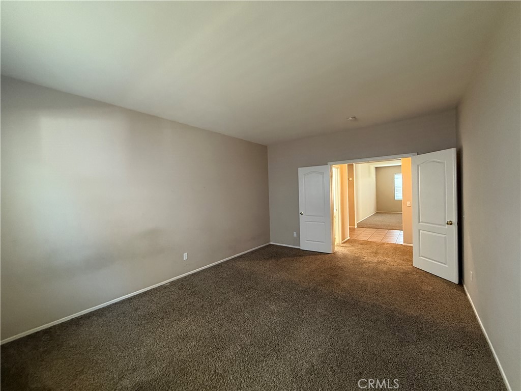 3518 Ranch Street Perris, CA 92571 - Photo 28 of 66 an empty room with windows