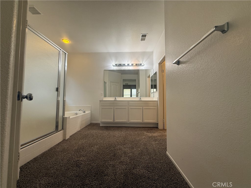 3518 Ranch Street Perris, CA 92571 - Photo 36 of 66 a bathroom with a sink a toilet and shower