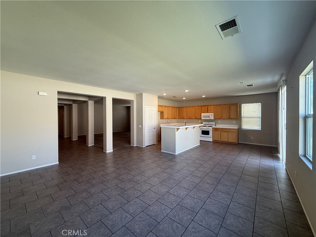 3518 Ranch Street Perris, CA 92571 - Photo 41 of 66 a view of a livingroom with an empty space and a fireplace