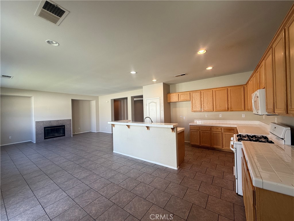 3518 Ranch Street Perris, CA 92571 - Photo 45 of 66 a kitchen with a sink and a stove top oven