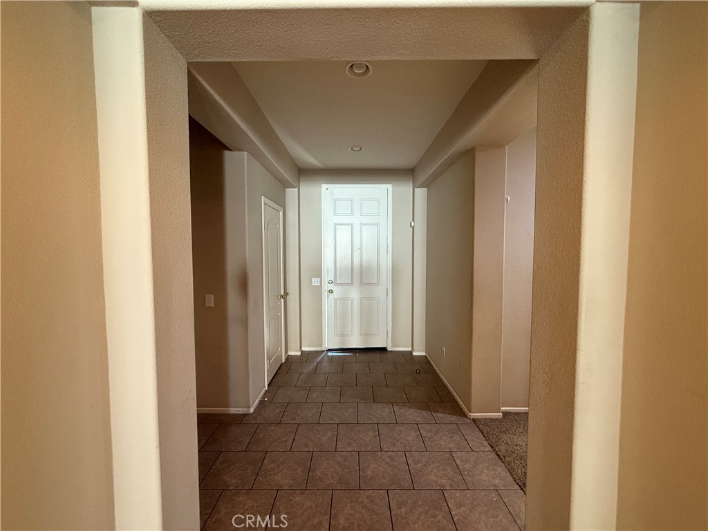 3518 Ranch Street Perris, CA 92571 - Photo 5 of 66 a view of a hallway with a window