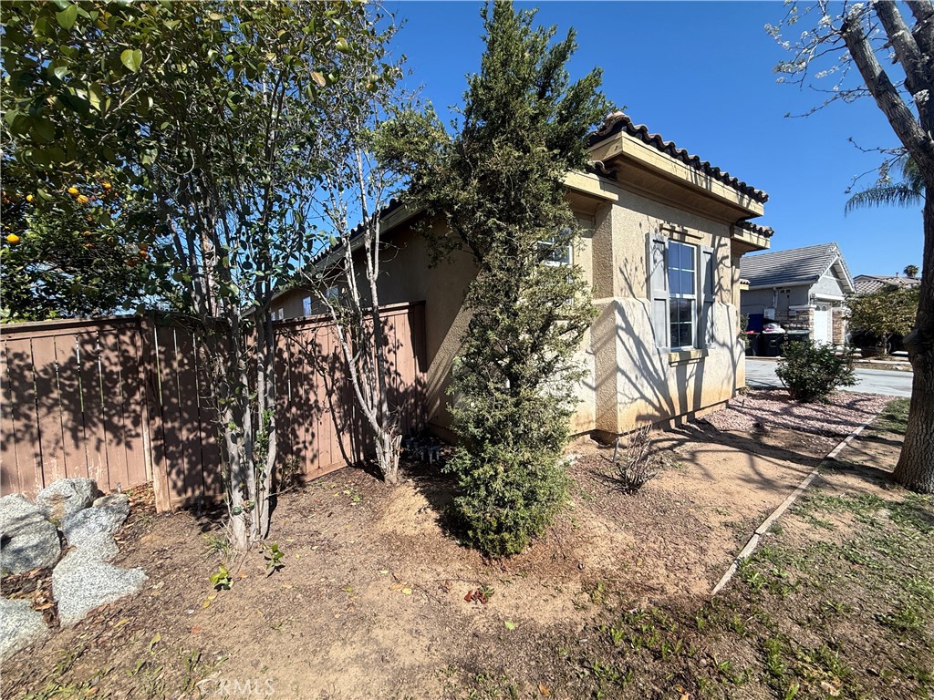 3518 Ranch Street Perris, CA 92571 - Photo 65 of 66 a view of a house with a yard