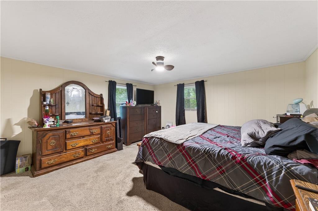 4399 Highway 411 Rydal, GA 30171 - Photo 14 of 37 a bedroom with a bed and wooden floor