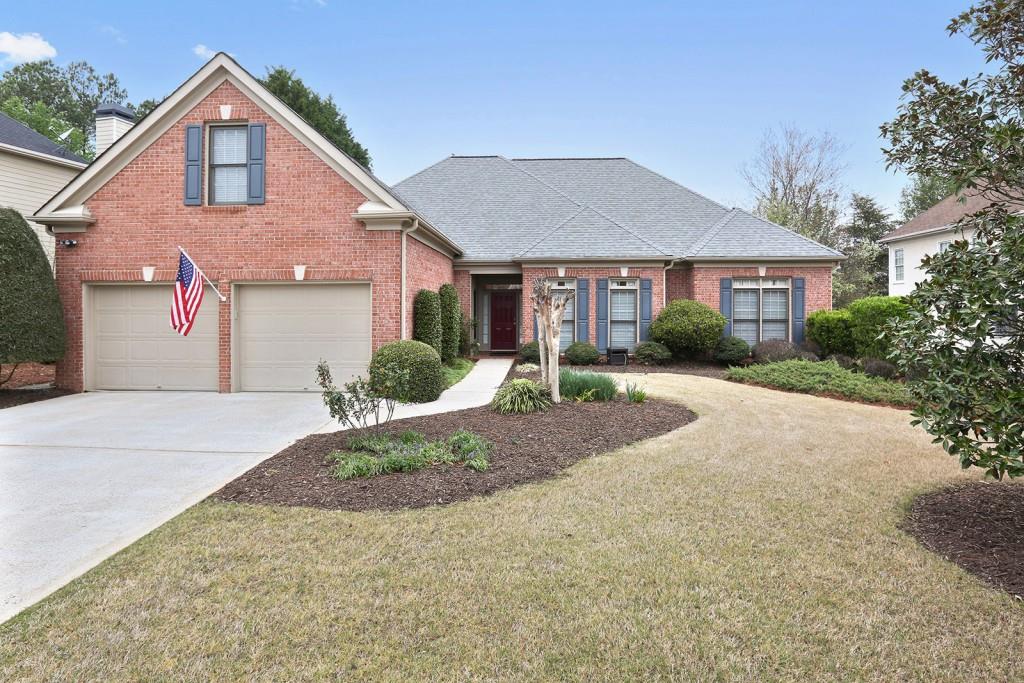 3755 Preakness Lane Suwanee, GA 30024 - Photo 1 of 1 a front view of a house with a yard and garage