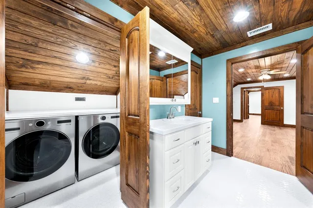 a view of a kitchen with washer and dryer