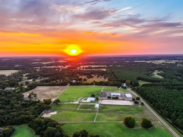 a view of a swimming pool and lounge chairs
