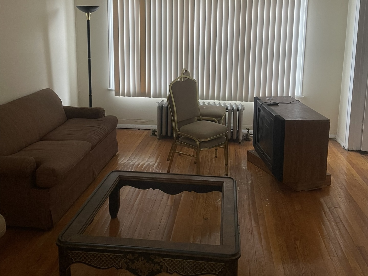 5338-58 West North Avenue Chicago, IL 60639 - Photo 11 of 13 a living room with furniture and a window
