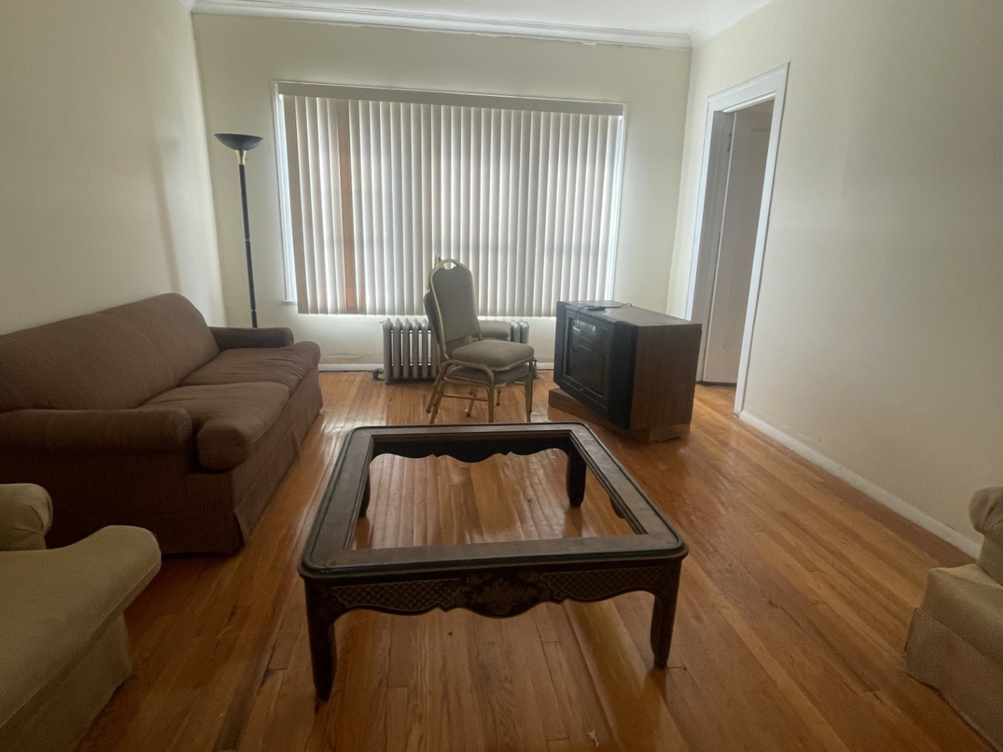5338-58 West North Avenue Chicago, IL 60639 - Photo 13 of 13 a living room with furniture and a window