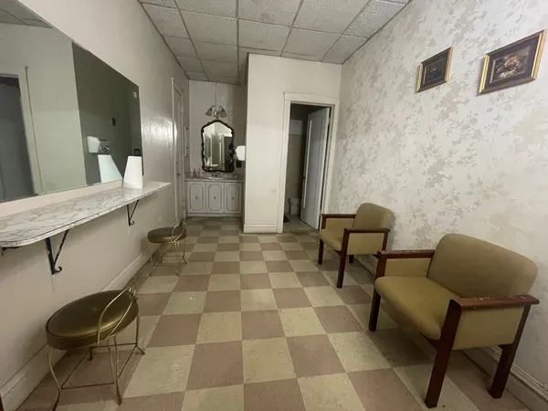 a balcony with chairs and table