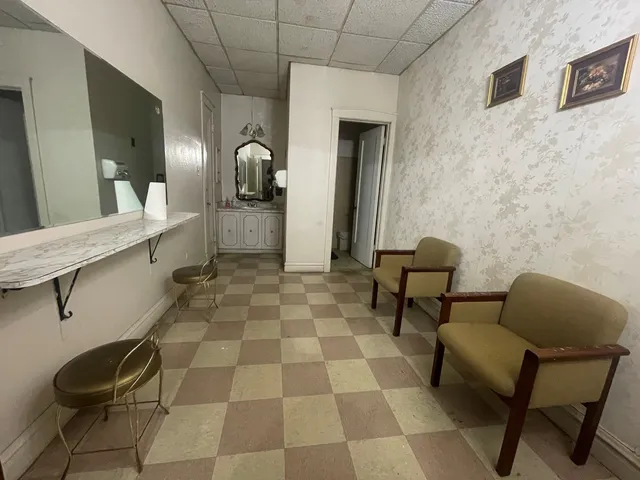 a balcony with chairs and table