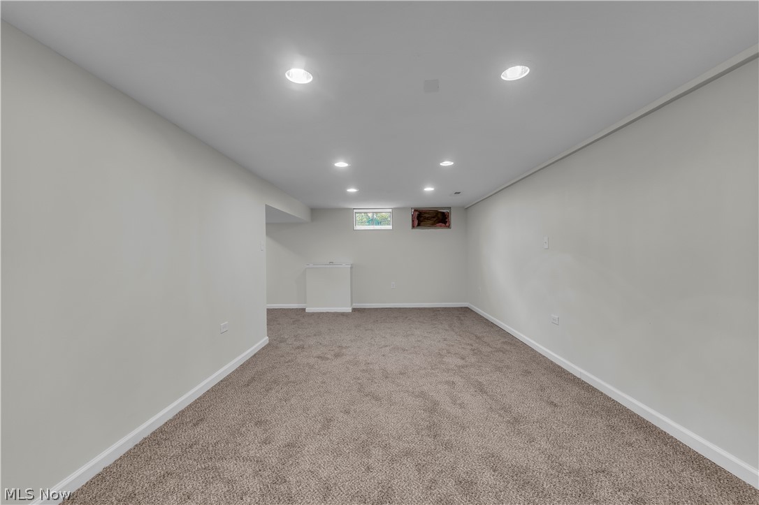 2540 Charney Road University Heights, OH 44118 - Photo 37 of 44 Expansive finished basement with recessed lighting, light gray walls, plush carpeting, and baseboard trim