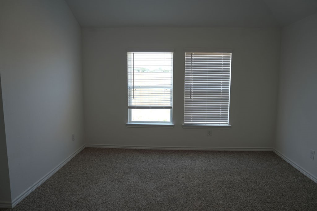 807 Stoney Point Lane Dayton, TX 77535 - Photo 11 of 19 an empty room with a window
