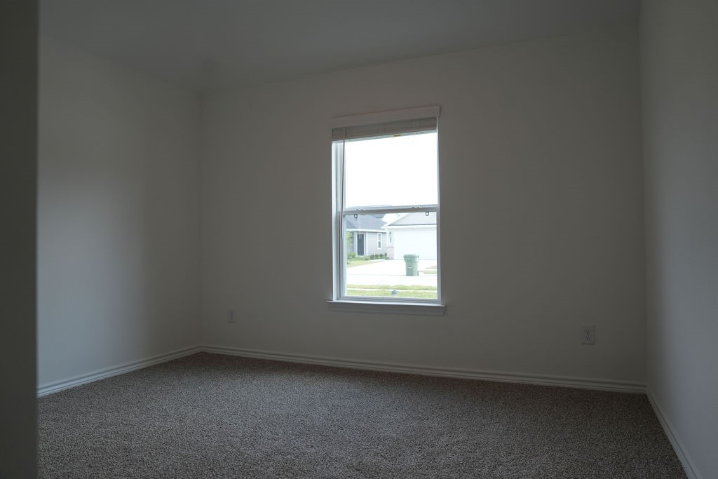807 Stoney Point Lane Dayton, TX 77535 - Photo 14 of 19 an empty room with a window