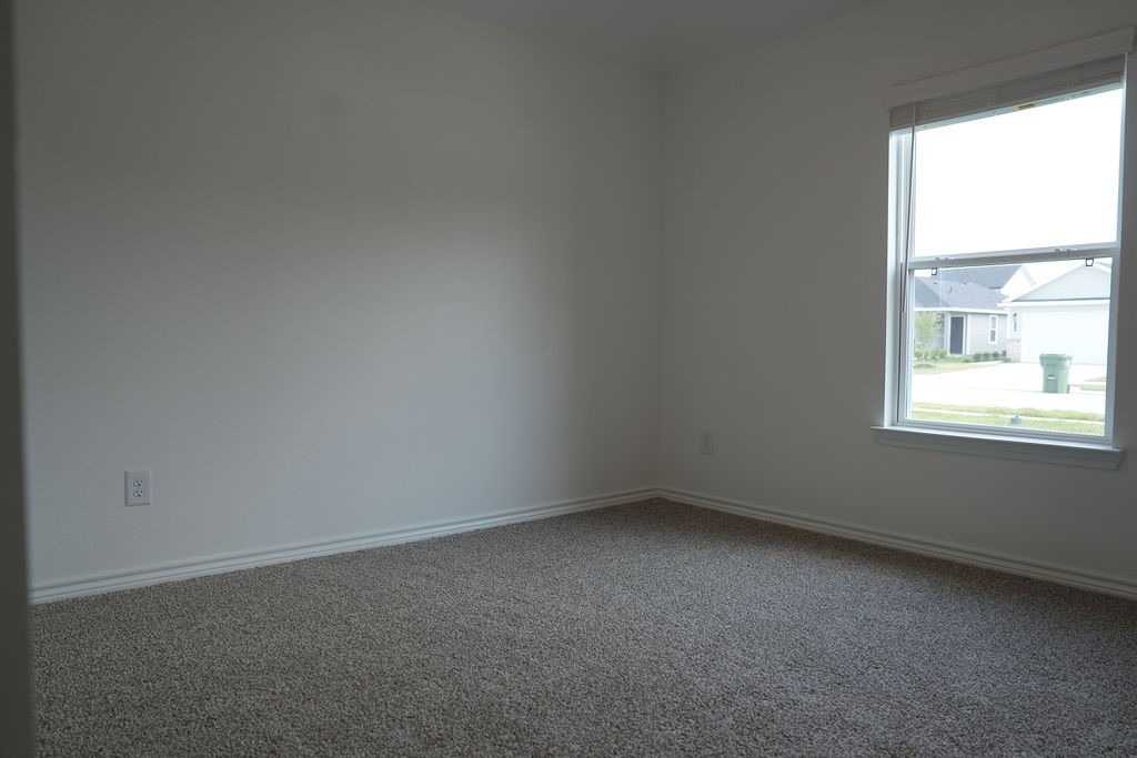 807 Stoney Point Lane Dayton, TX 77535 - Photo 15 of 19 an empty room with a window