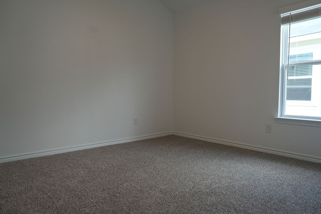 807 Stoney Point Lane Dayton, TX 77535 - Photo 18 of 19 an empty room with a window
