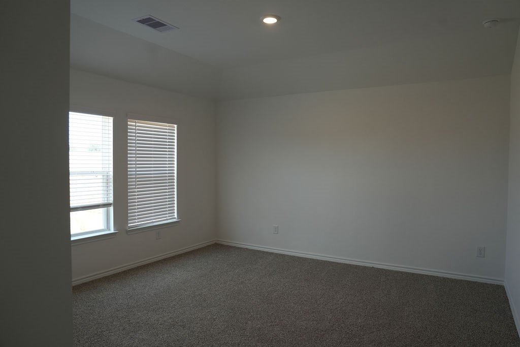 807 Stoney Point Lane Dayton, TX 77535 - Photo 8 of 19 an empty room with a window