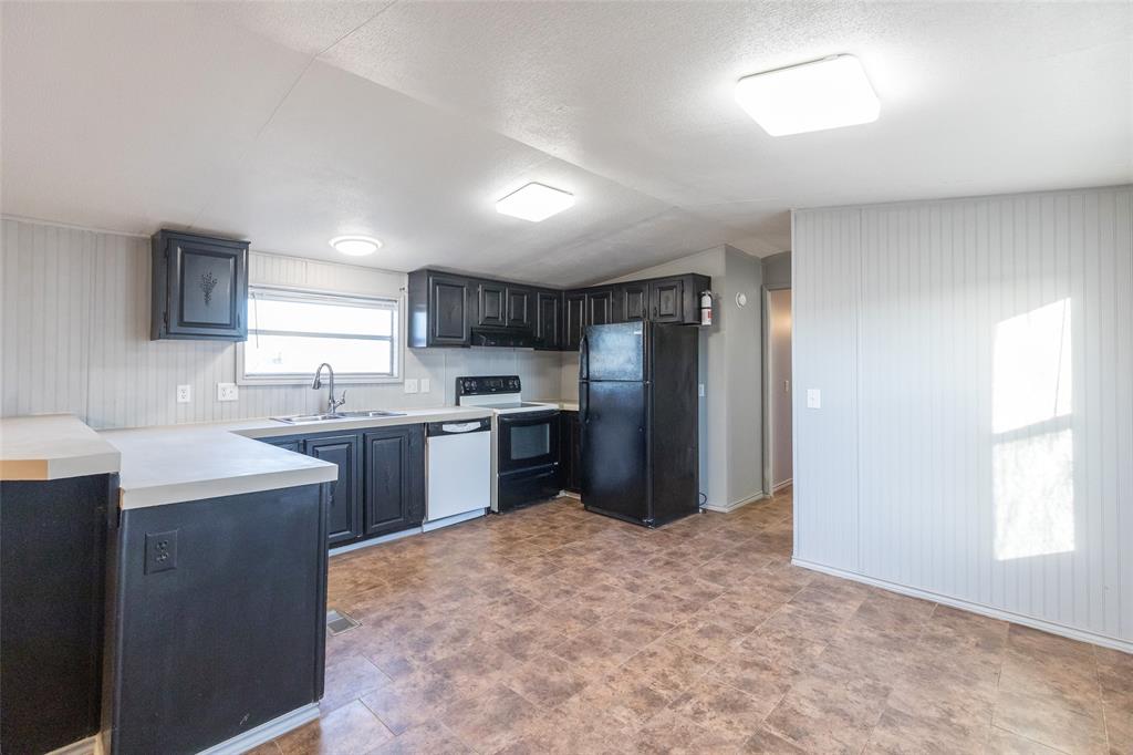 709 Gibson Street Tye, TX 79603 - Photo 16 of 26 a kitchen with refrigerator and window