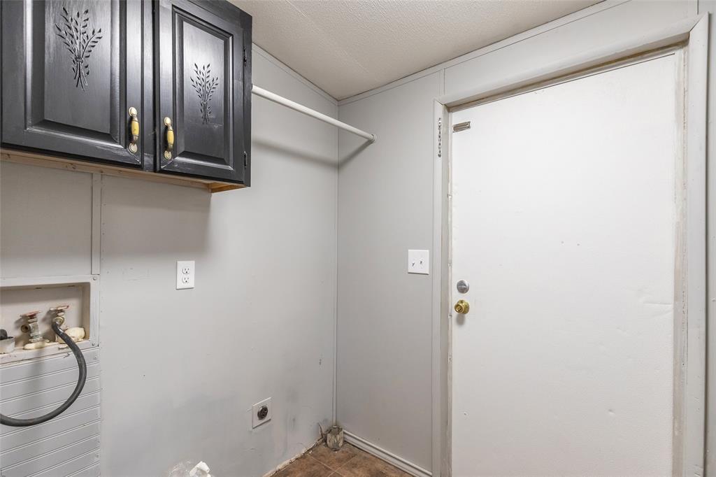 709 Gibson Street Tye, TX 79603 - Photo 19 of 26 a bathroom with a granite countertop shower and a sink
