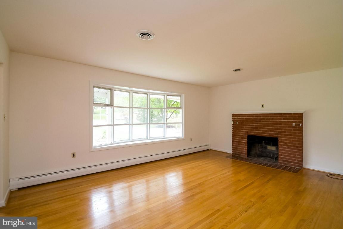 11809 Wayneridge Street Fulton, MD 20759 - Photo 4 of 25 hardwood floor, wood burning fireplace