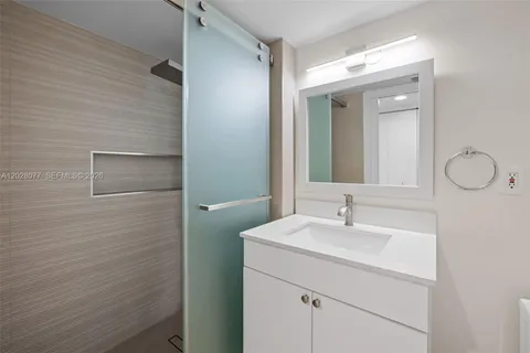 a bathroom with a sink and mirror